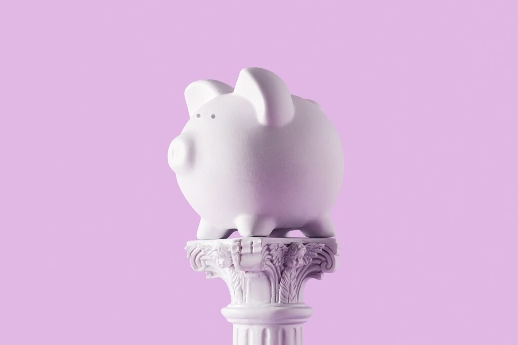 piggy-bank-on-antique-column-2022-02-04-20-31-17-utc